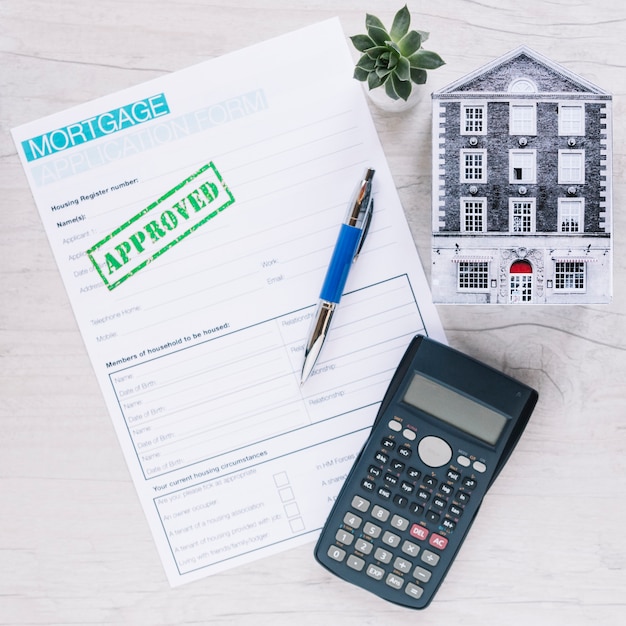 Free photo arranged mortgage approved paper on desk