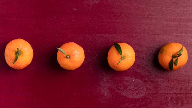 Arranged tangerine with red background for chinese new year