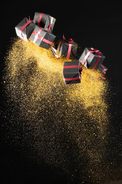 Arrangement of black friday gifts with golden glitter