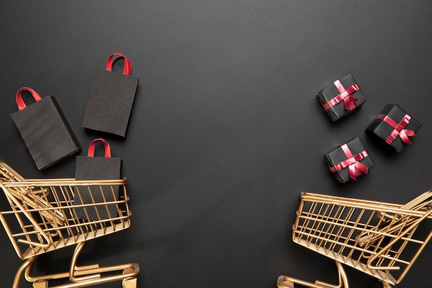 Arrangement of black friday shopping carts with copy space