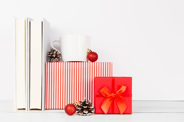 Arrangement of books and christmas gifts