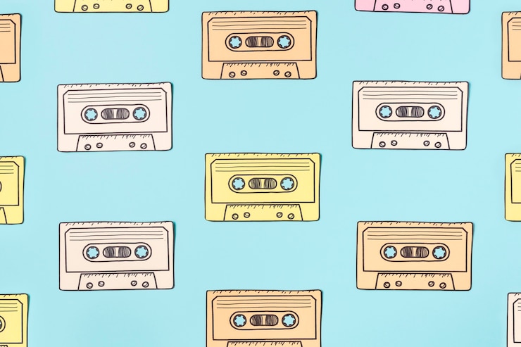 Free Photo arrangement of cassette tape on blue