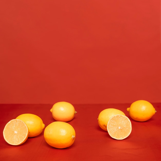 Arrangement of citruses on red