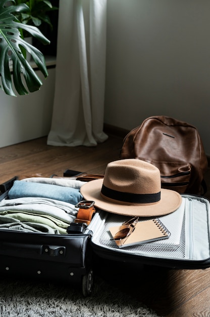 Arrangement of clothes and accessories in a suitcase