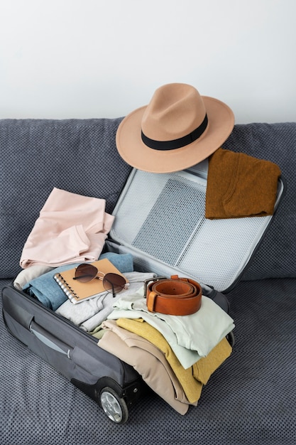 Arrangement of clothes and accessories in a suitcase