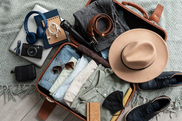 arrangement of clothes and accessories in a suitcase
