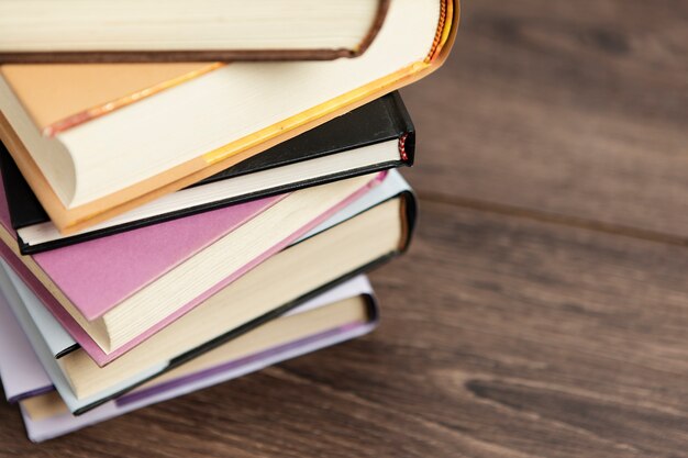 Arrangement of colorful books on wooden table