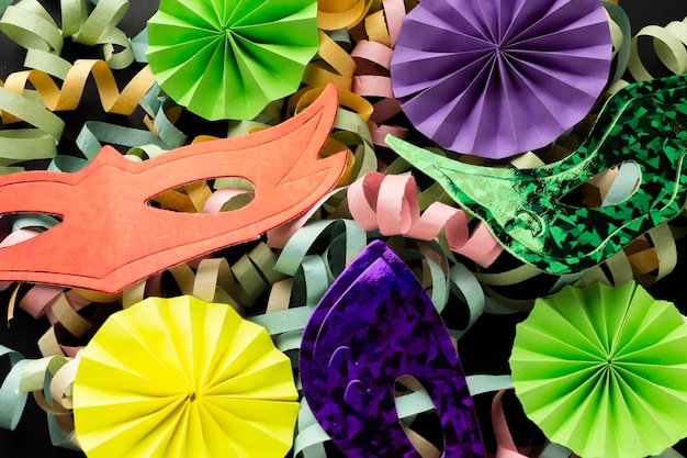 Free photo arrangement of colorful paper ribbons and masks