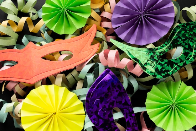 Arrangement of colorful paper ribbons and masks