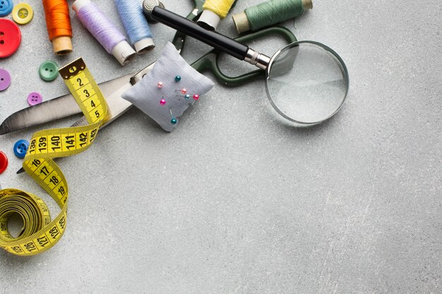 Arrangement of colourful accessories for sewing flat lay