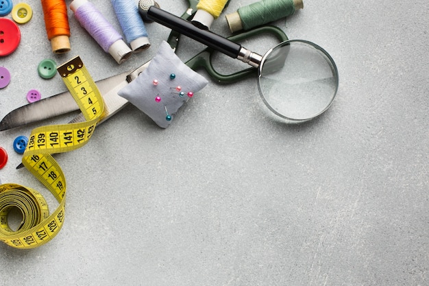 Arrangement of colourful accessories for sewing flat lay