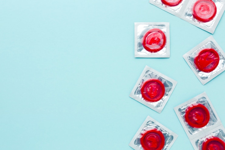 Free Photo arrangement of contraception concept with red condoms