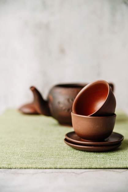 Arrangement of cups and plates with blurred background