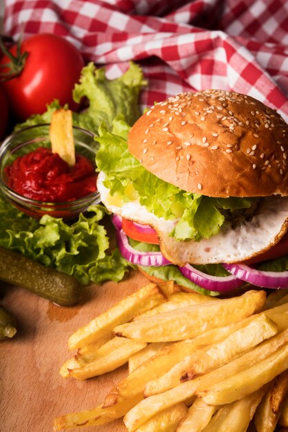 Arrangement of delicious hamburger and fries