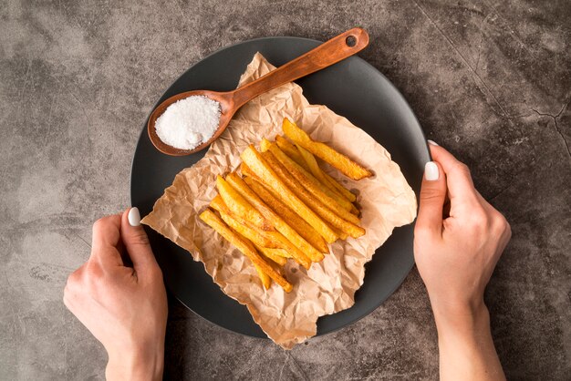 Arrangement of delicious potato fries in plate