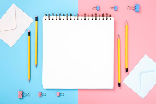 Arrangement of desk elements with empty notebook