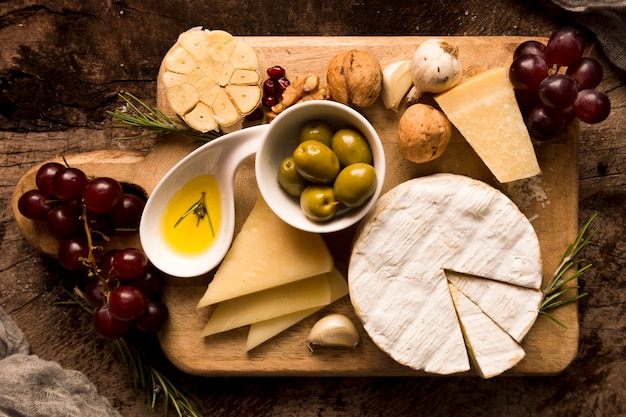 Arrangement of different delicacies on wooden table