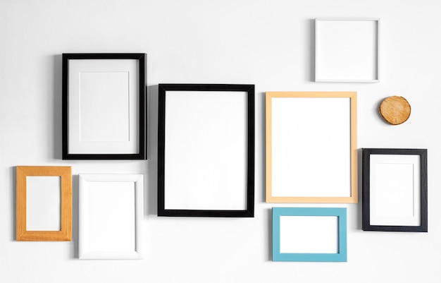 Free photo arrangement of different frames on a wall