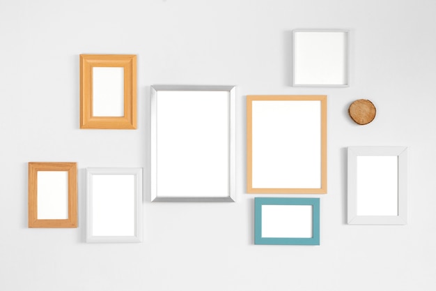 Free photo arrangement of different frames on a wall