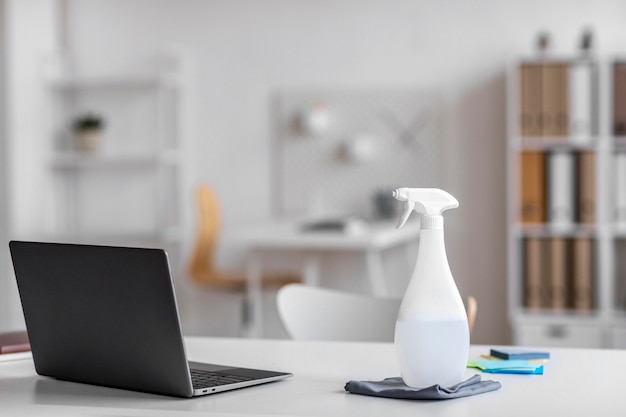 Free photo arrangement of disinfecting products on a desk