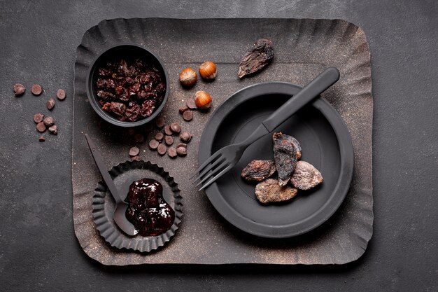 Arrangement of dried fruit and marmalade on cardboard tray