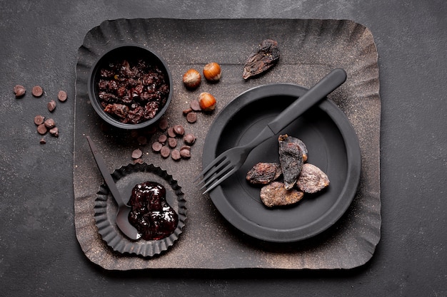 Arrangement of dried fruit and marmalade on cardboard tray