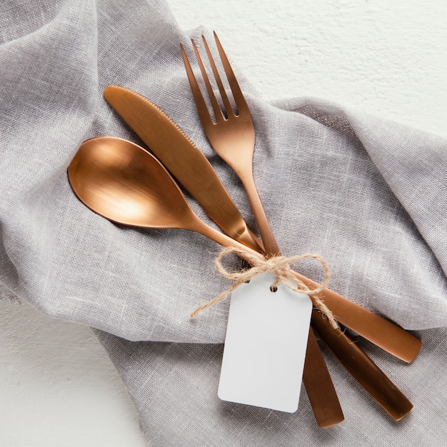 Arrangement of elegant tableware with empty tag