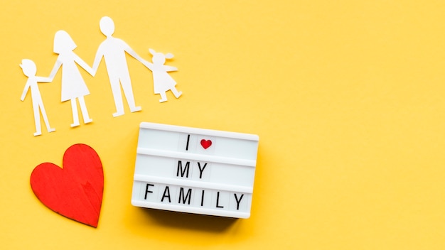 Arrangement for family concept on yellow background with copy space