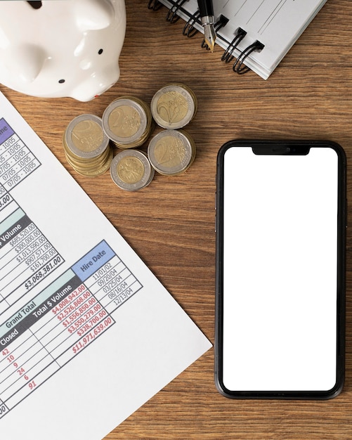 Free photo arrangement of finances elements with empty smartphone