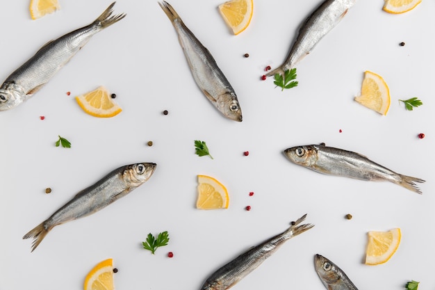 Free photo arrangement of fish and lemon top view