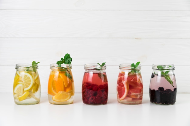 Free photo arrangement of fresh fruit juice