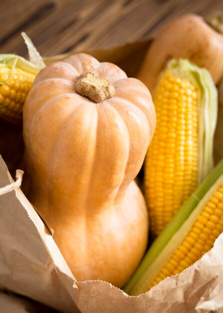 Arrangement of fresh pumpkin and corn