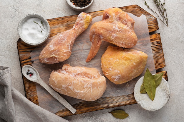 Arrangement of frozen chicken on the table