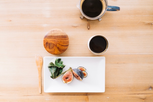 Free photo arrangement of fruit with coffee on table