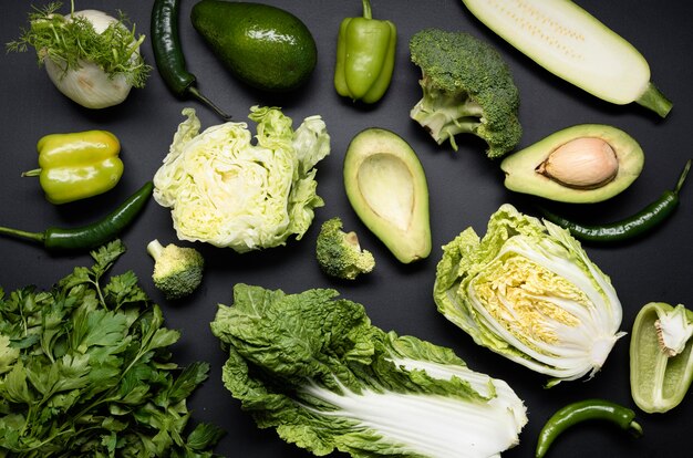Arrangement of green veggies and avocado