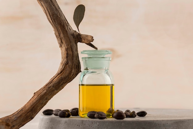 Free photo arrangement of jojoba oil bottle