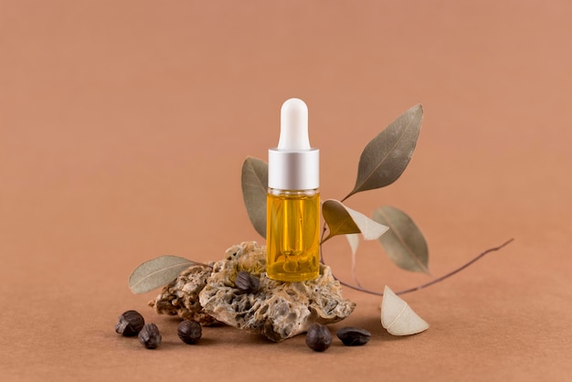 Free photo arrangement of jojoba oil dropper