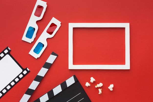 Free photo arrangement of movie elements on red background