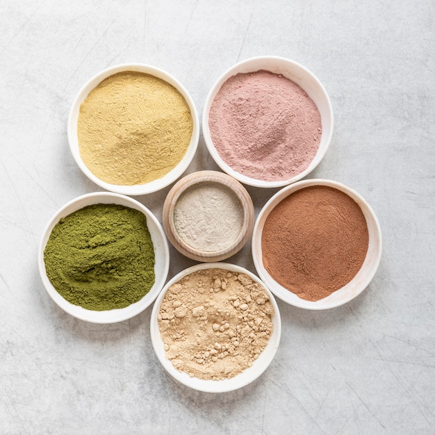 Arrangement of natural spa sand in bowls top view