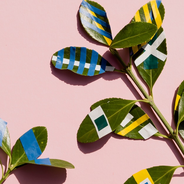 Arrangement of painted ficus leaves