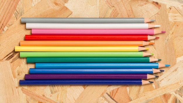 Arrangement of rainbow coloured pencils