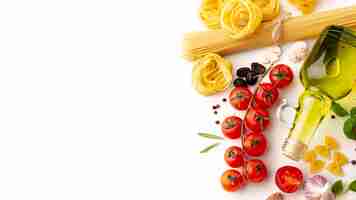 Free photo arrangement of raw pasta and ingredients with copy space