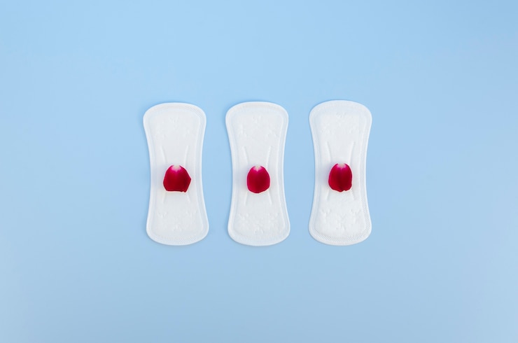 Free Photo arrangement of sanitary towels with flower petals