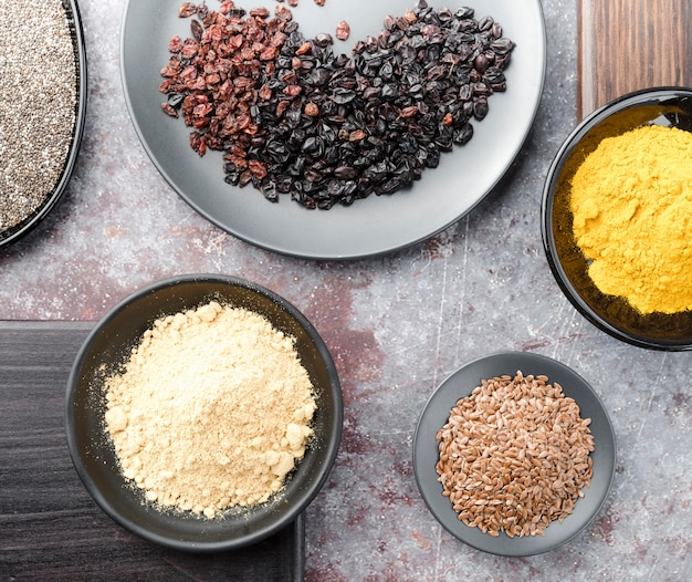 Free photo arrangement of seeds and raisins in bowls