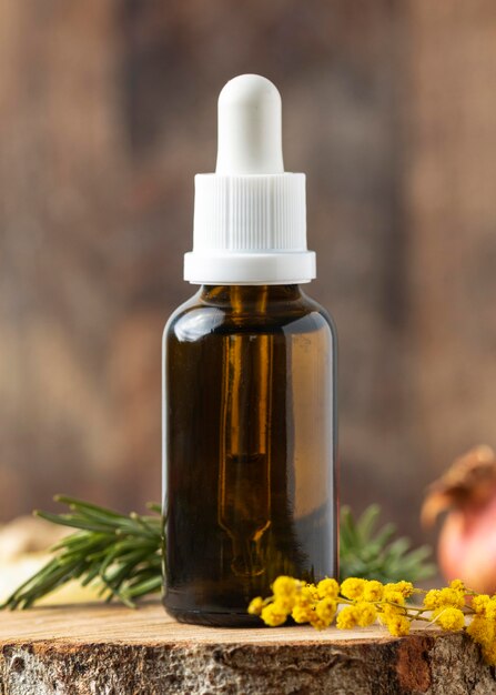 Arrangement serum bottle and plant