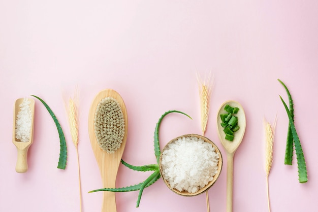 Arrangement of spoons and aloe vera leaves