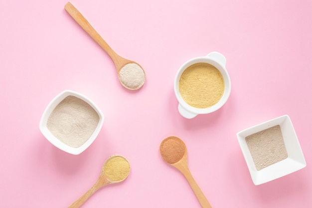 Arrangement of spoons and bowls with sand