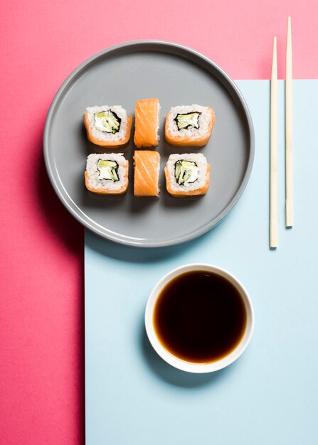 Arrangement of sushi rolls and soy sauce