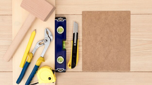 Arrangement of tools for carpentry on desk copy space