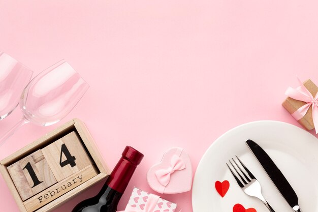 Arrangement for valentine's day dinner on pink background with copy space